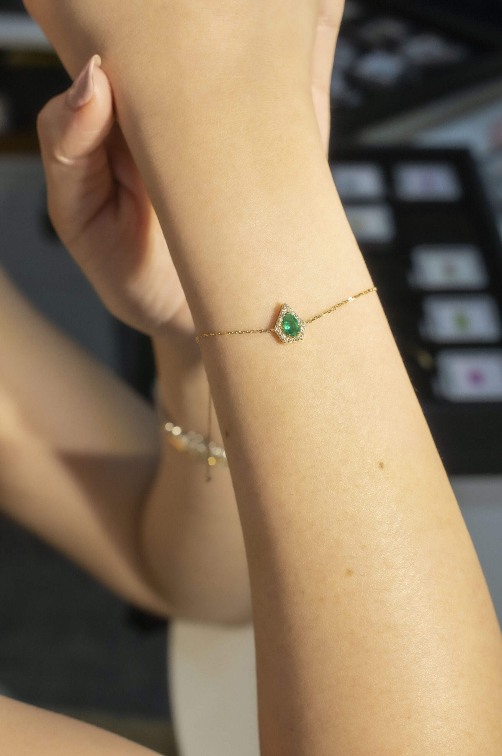 Model Photo Oval Emerald and Diamond Halo Shield Pendant Bracelet in Yellow Gold