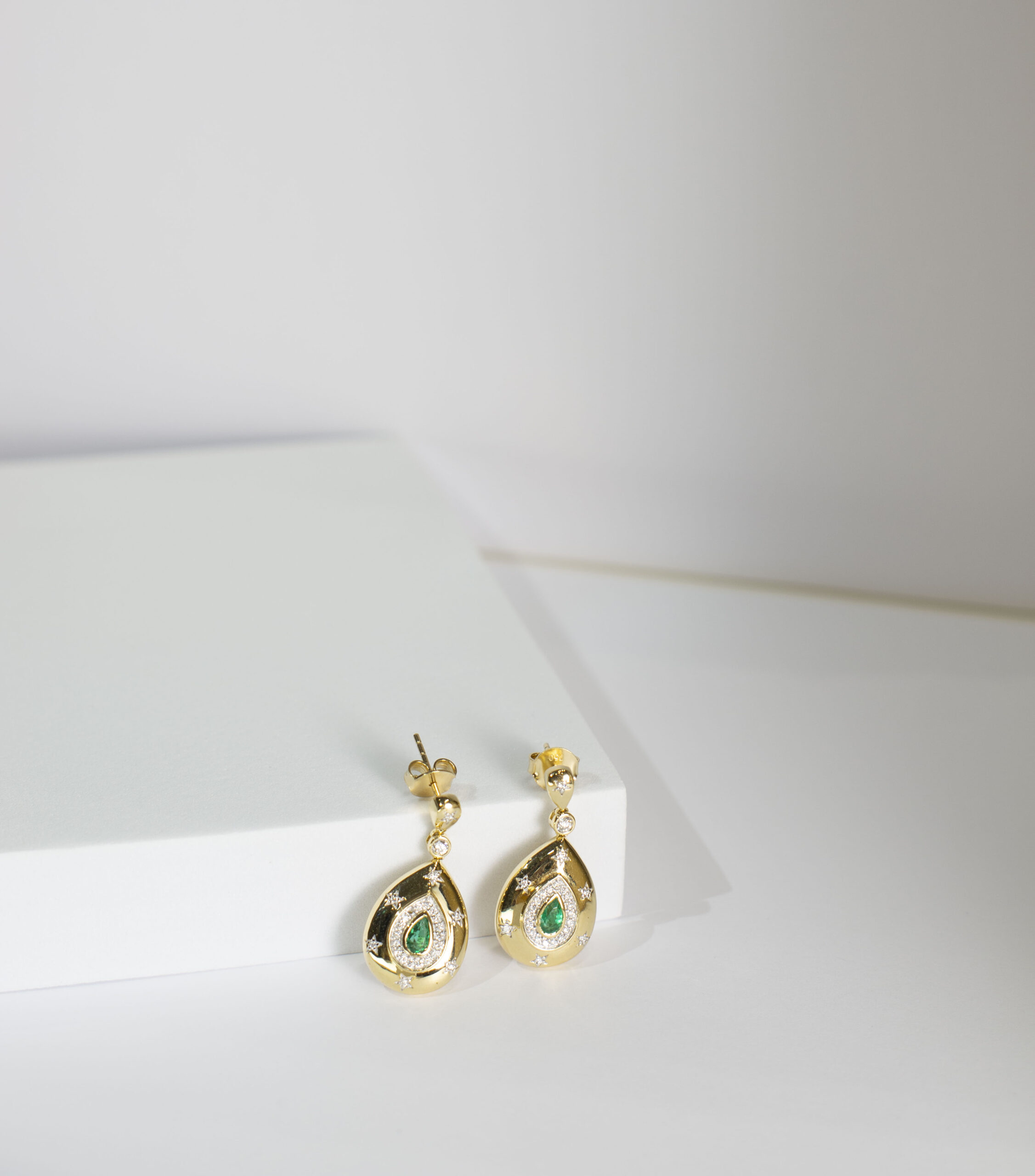 Star-Accented Emerald and Diamond Pear Drop Earrings in Yellow Gold